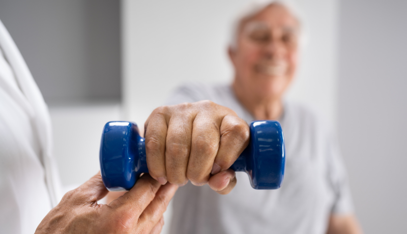 Older adult working with a therapist on balance and mobility